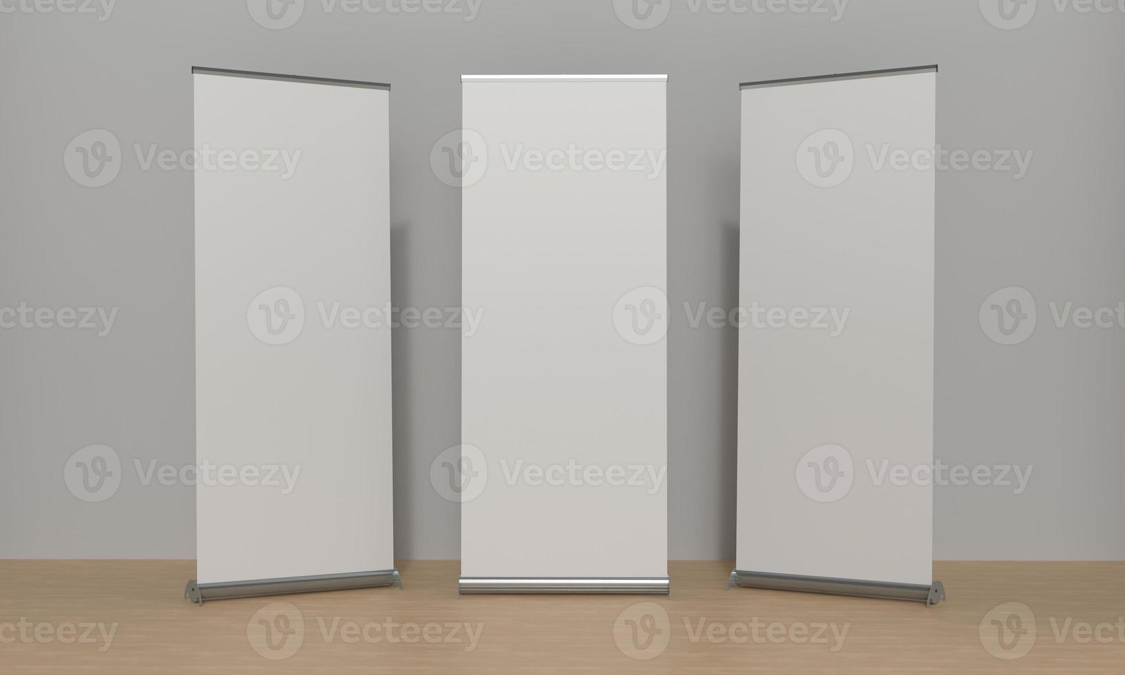 Set of 3 Roll Up Banners Side by Side in front of a grey wall and Laminate Flooring. 3D Render Illustration with Copy Space for Mockup and illustrations. photo