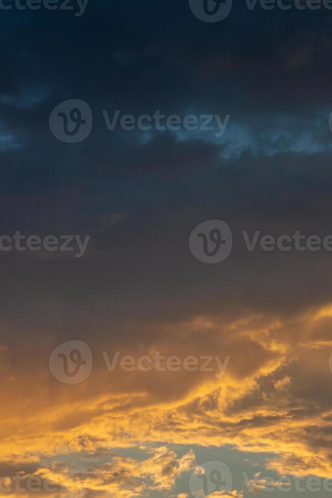 Cover page with gradient soft deep orange sky, illuminated clouds at bloody sunset as a background. photo