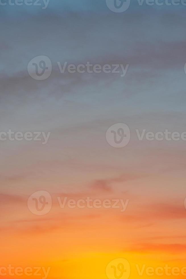 Cover page with deep blue sky with illuminated clouds at bloody sunset as a background. photo
