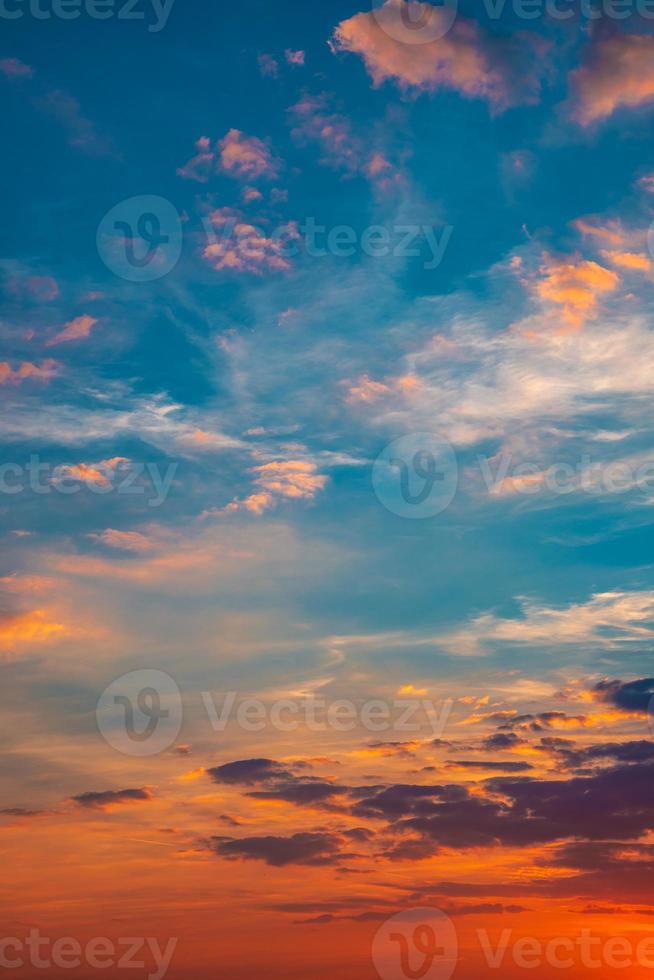Cover page with deep orange sky, illuminated clouds at bloody sunset as a background. photo