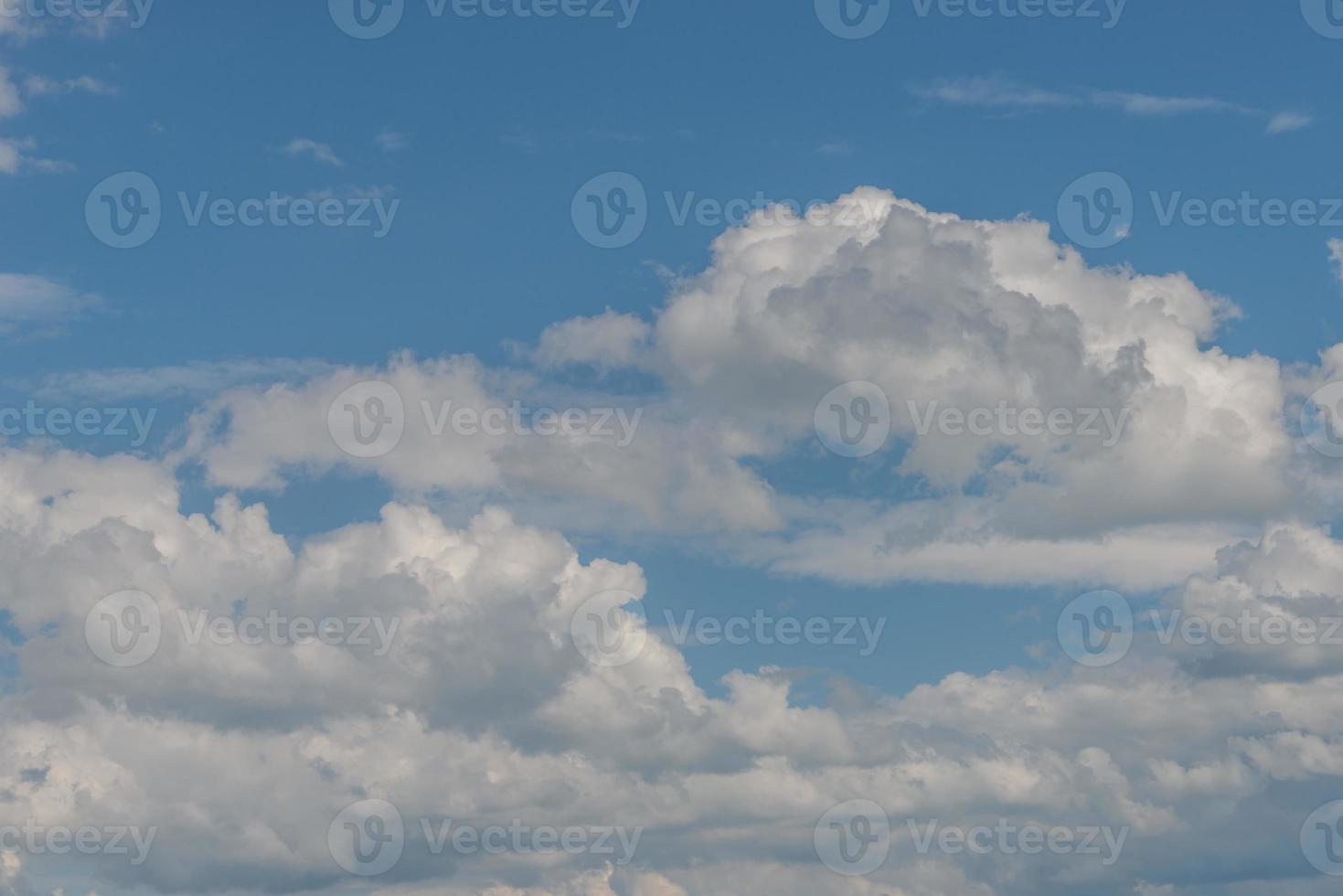 Cover page with soft blue sky with illuminated clouds as a background. photo
