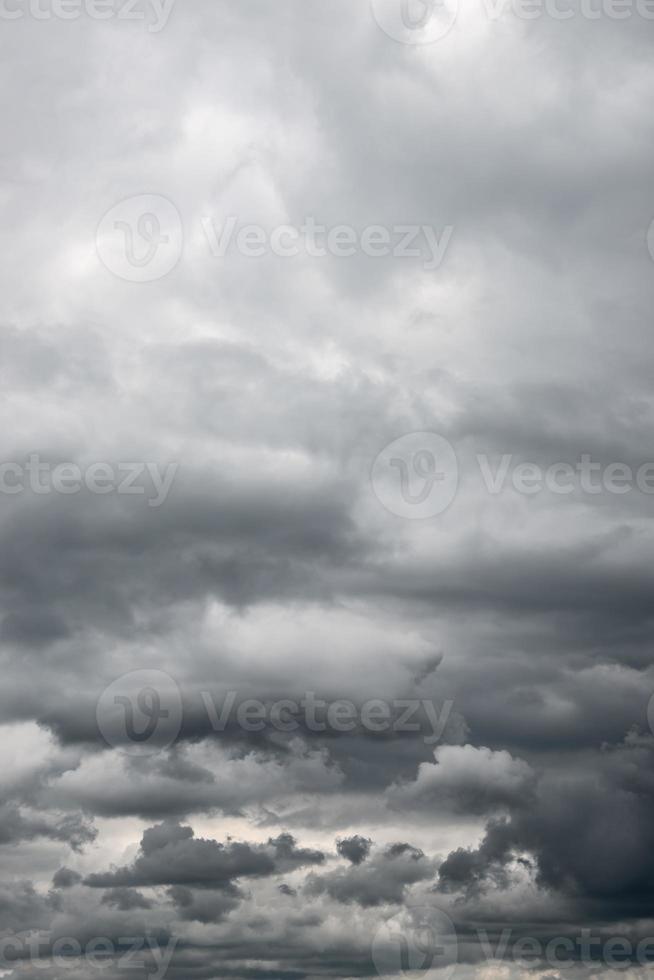 Cover page with dramatic rainy and stormy sky with heavy clouds as a background with copy space. photo