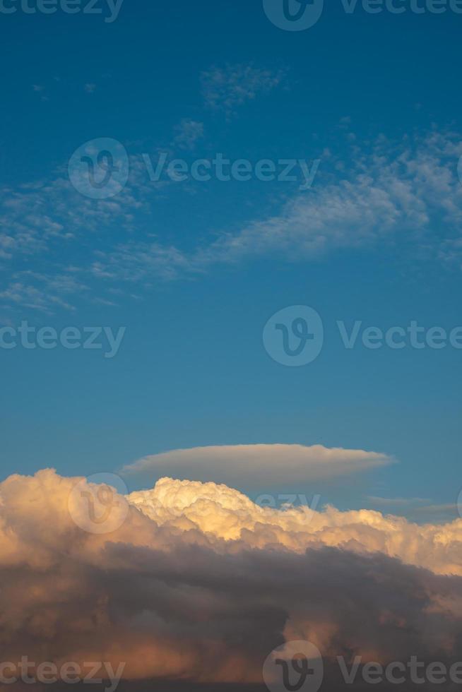 Cover page with gradient soft deep orange sky, illuminated clouds at bloody sunset as a background. photo