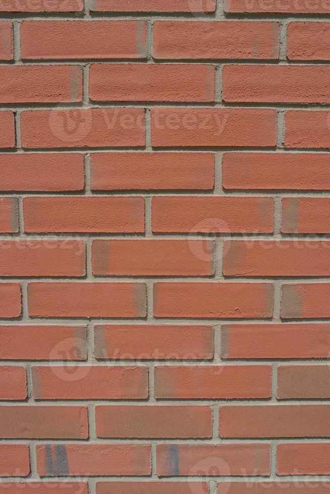 Pattern of modern bricks of a building wall, as a background, closeup, details. photo