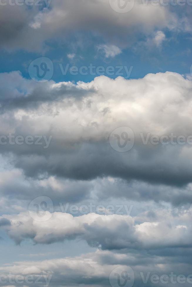 Cover page with deep blue sky with illuminated clouds as a background. photo