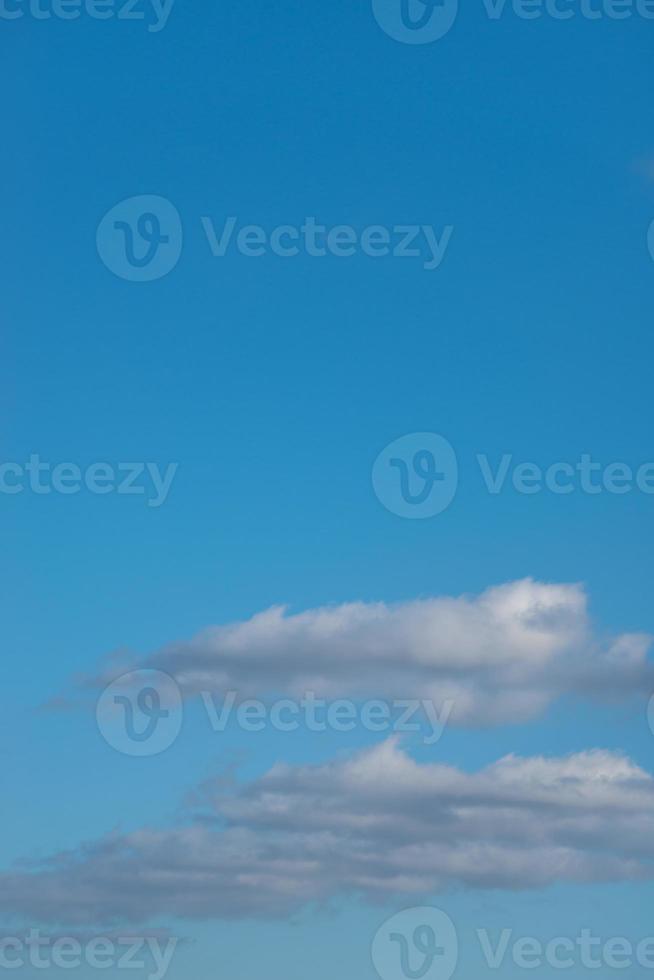 Cover page with blue deep sky with clouds as a background with copy space. photo