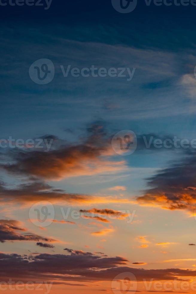 Cover page with gradient deep orange sky, illuminated clouds at bloody sunset as a background. photo