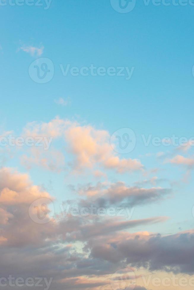 Cover page with deep blue sky with illuminated clouds at bloody sunset as a background. photo