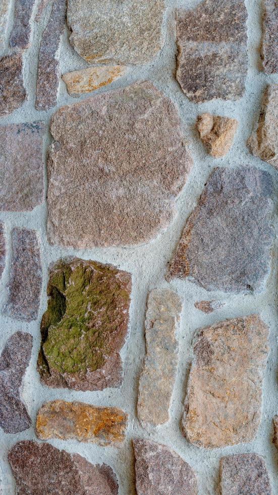 Cover page with middle age stone wall with patterns of ancient bricks and stones as a background, closeup, details. photo