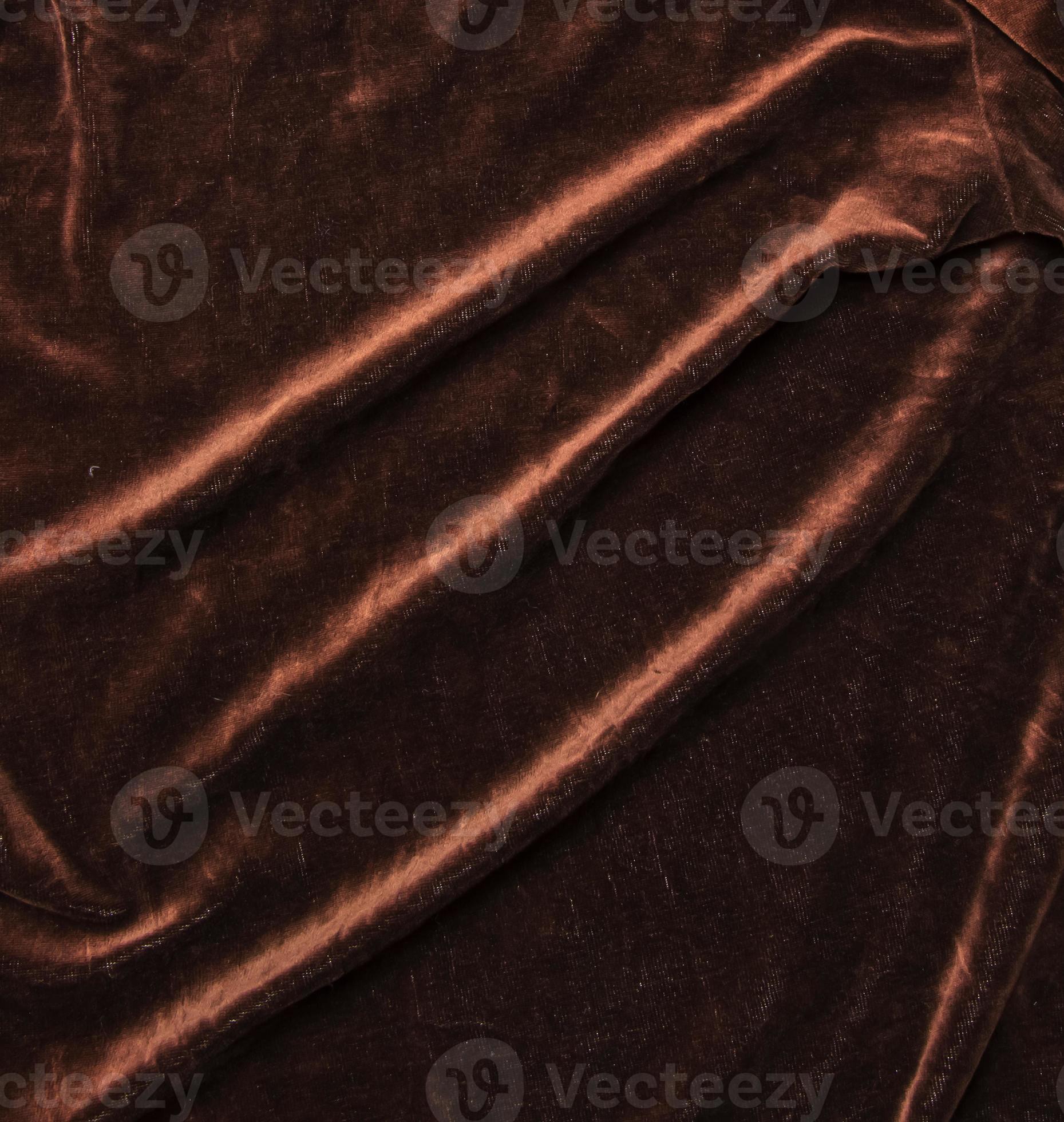 Background of brown velor fabric. Modern upholstered velvet furniture