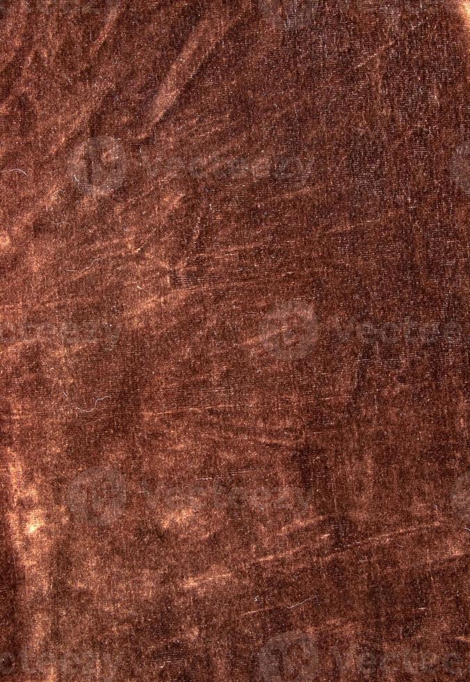 Background of brown velor fabric. Modern upholstered velvet furniture