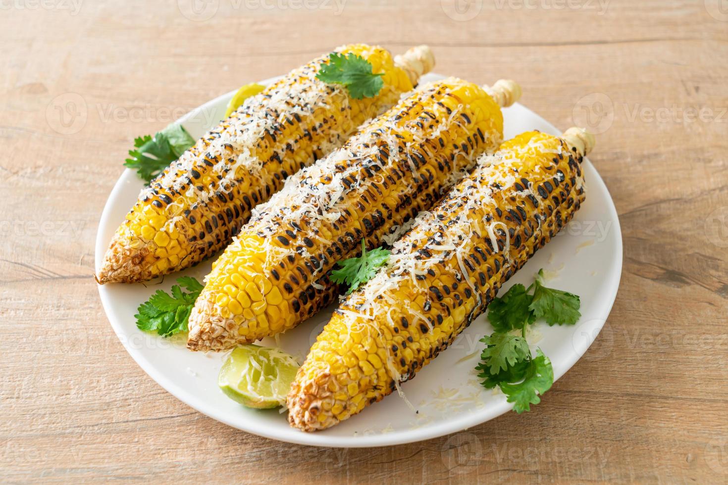 barbecue and grilled corn with cheese and lime photo