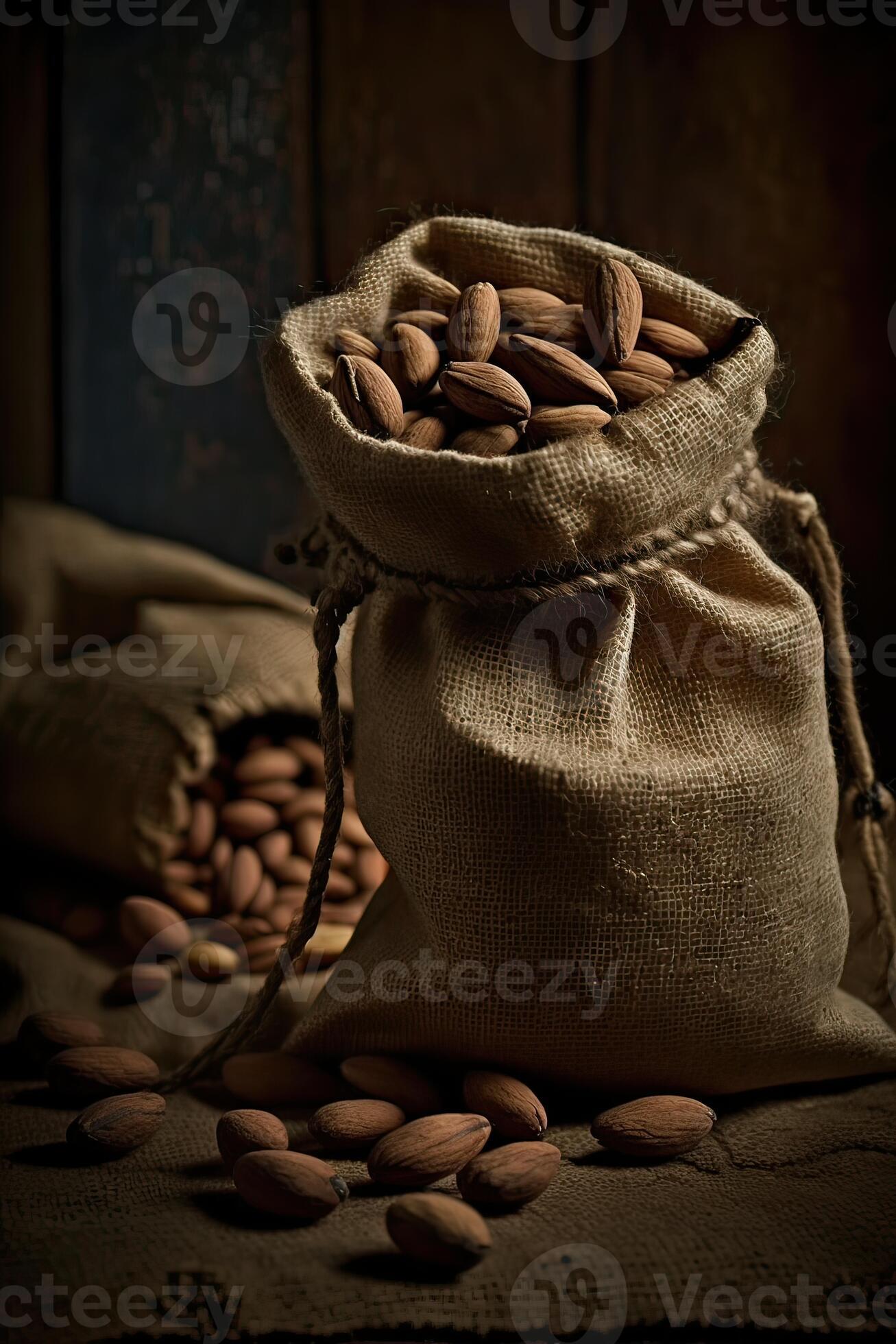 Roasted coffee beans falling in a burlap sack. Sackcloth bag with