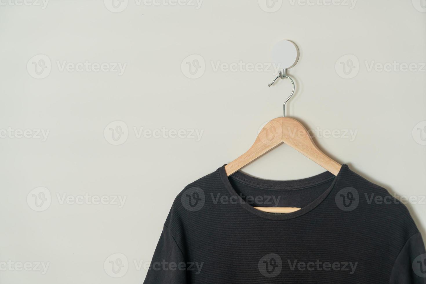 t-shirt hanging with wood hanger photo