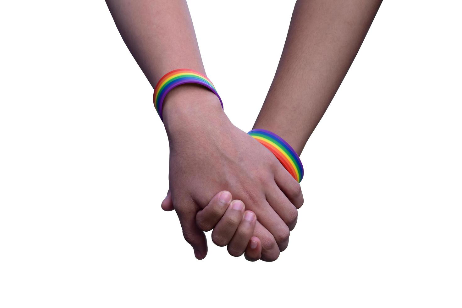 Isolated hands which wear rainbow wristband around them with clipping paths. photo