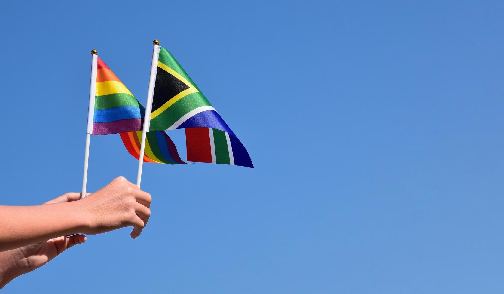 Isolated South Africa flag and rainbow flag with clipping paths photo