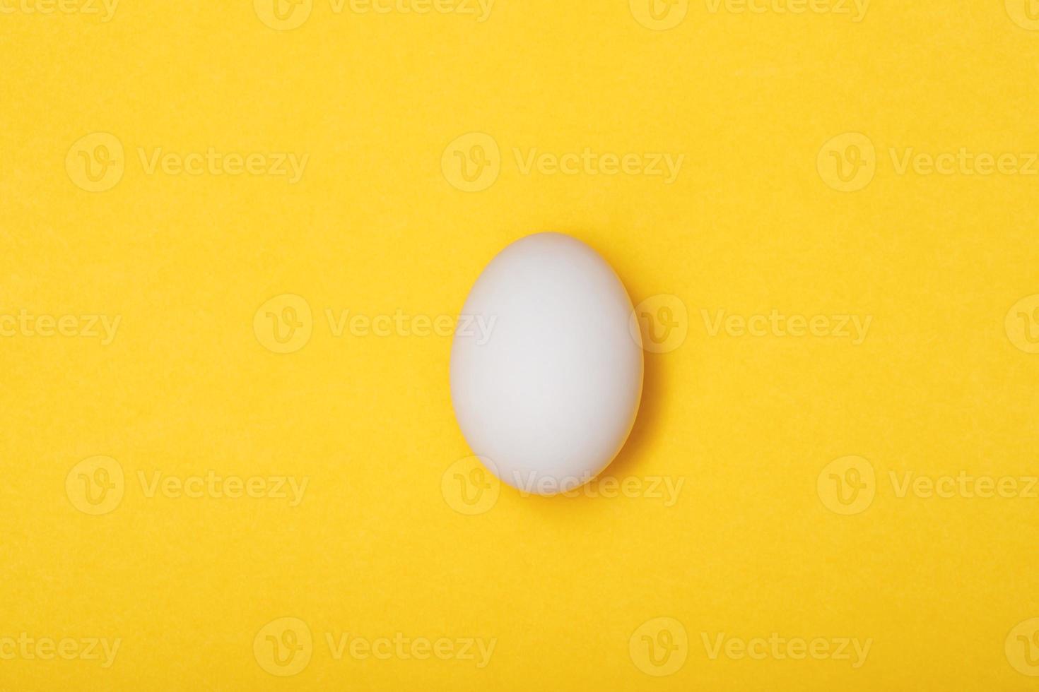 Top view egg yolk and egg white high protein good for body yellow background. photo