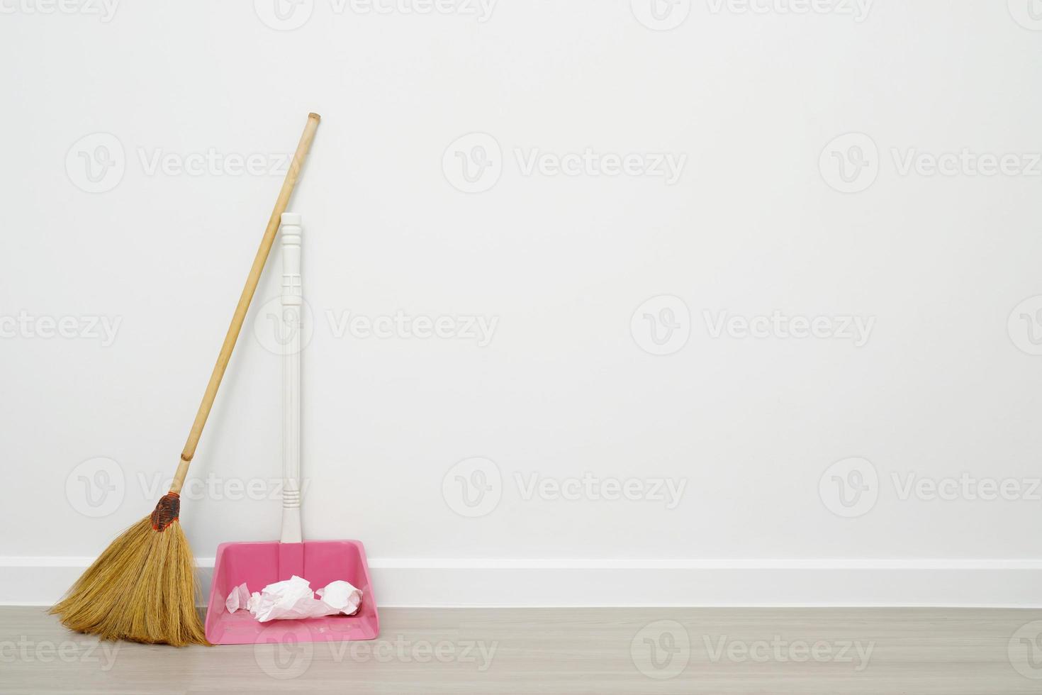 Broom and dustpan with house cleaning photo