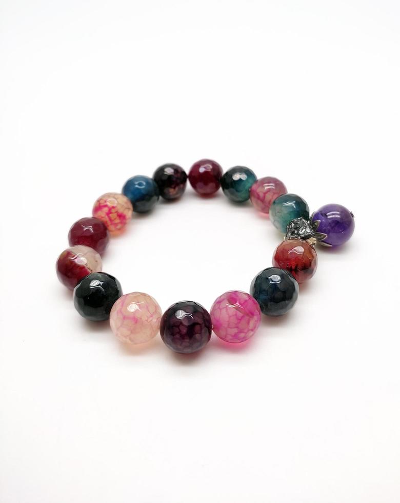 colorful beaded bracelet isolated in white background photo