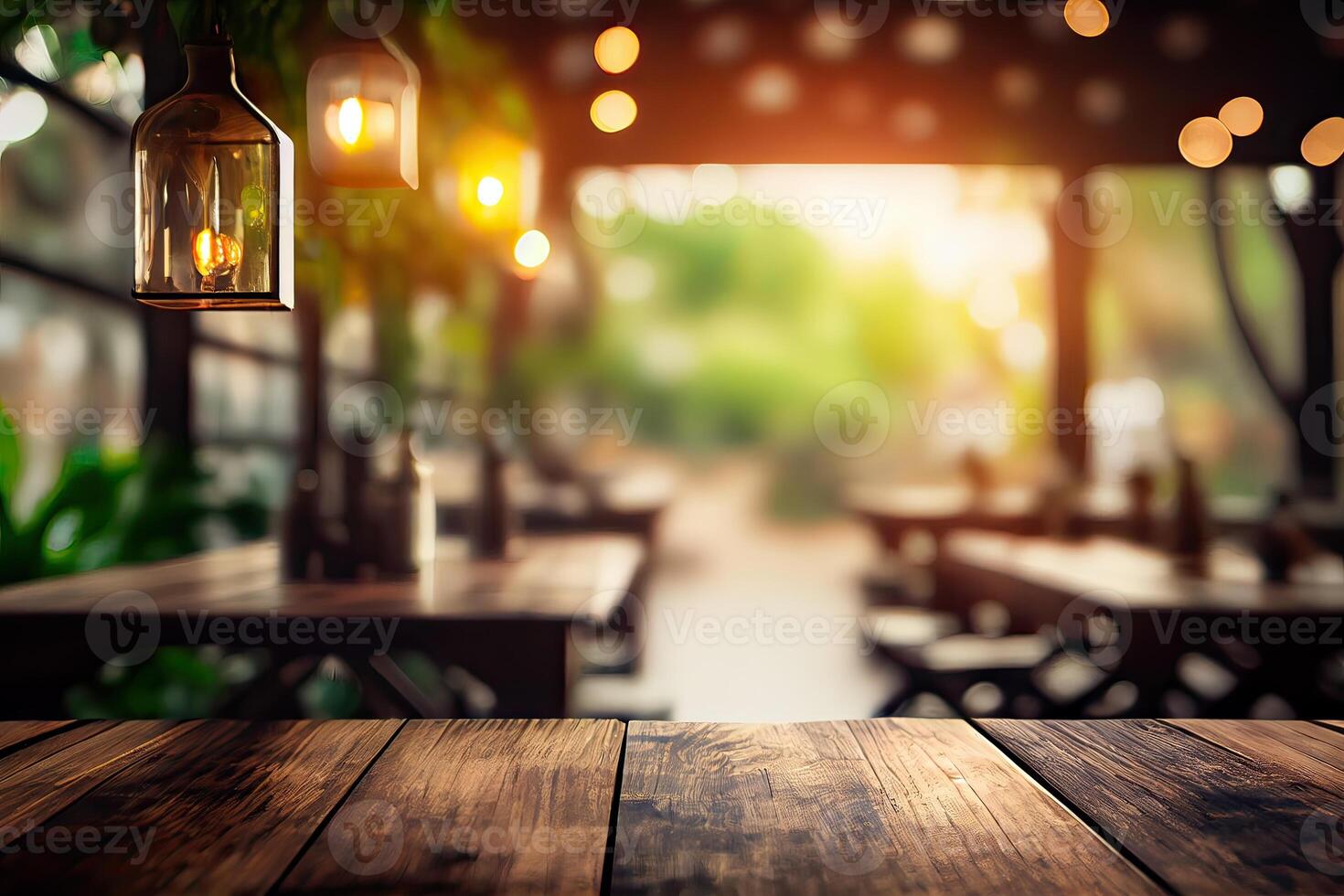 image of wooden table in front of abstract blurred background of resturant lights. Wood table top on blur of lighting in night cafe,restaurant background. selective focus. photo