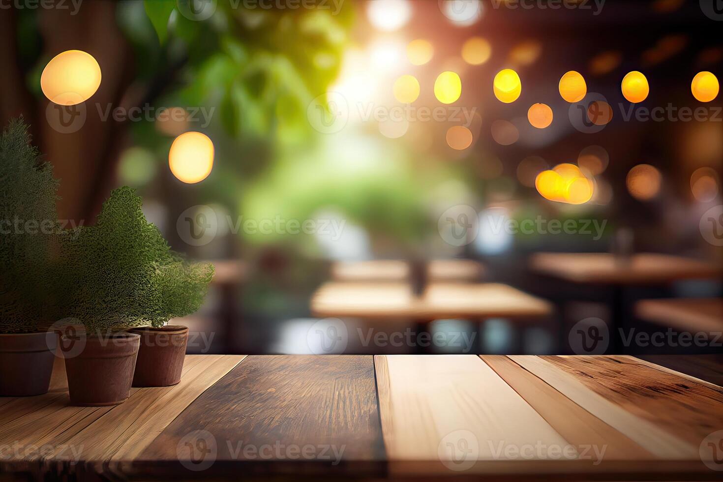 image of wooden table in front of abstract blurred background of resturant lights. Wood table top on blur of lighting in night cafe,restaurant background. selective focus. photo