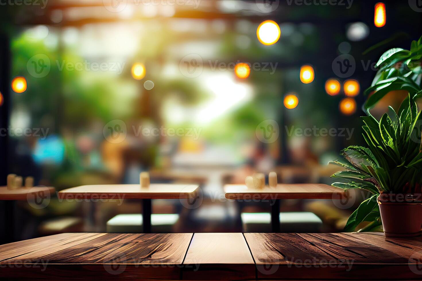 image of wooden table in front of abstract blurred background of resturant lights. Wood table top on blur of lighting in night cafe,restaurant background. selective focus. photo