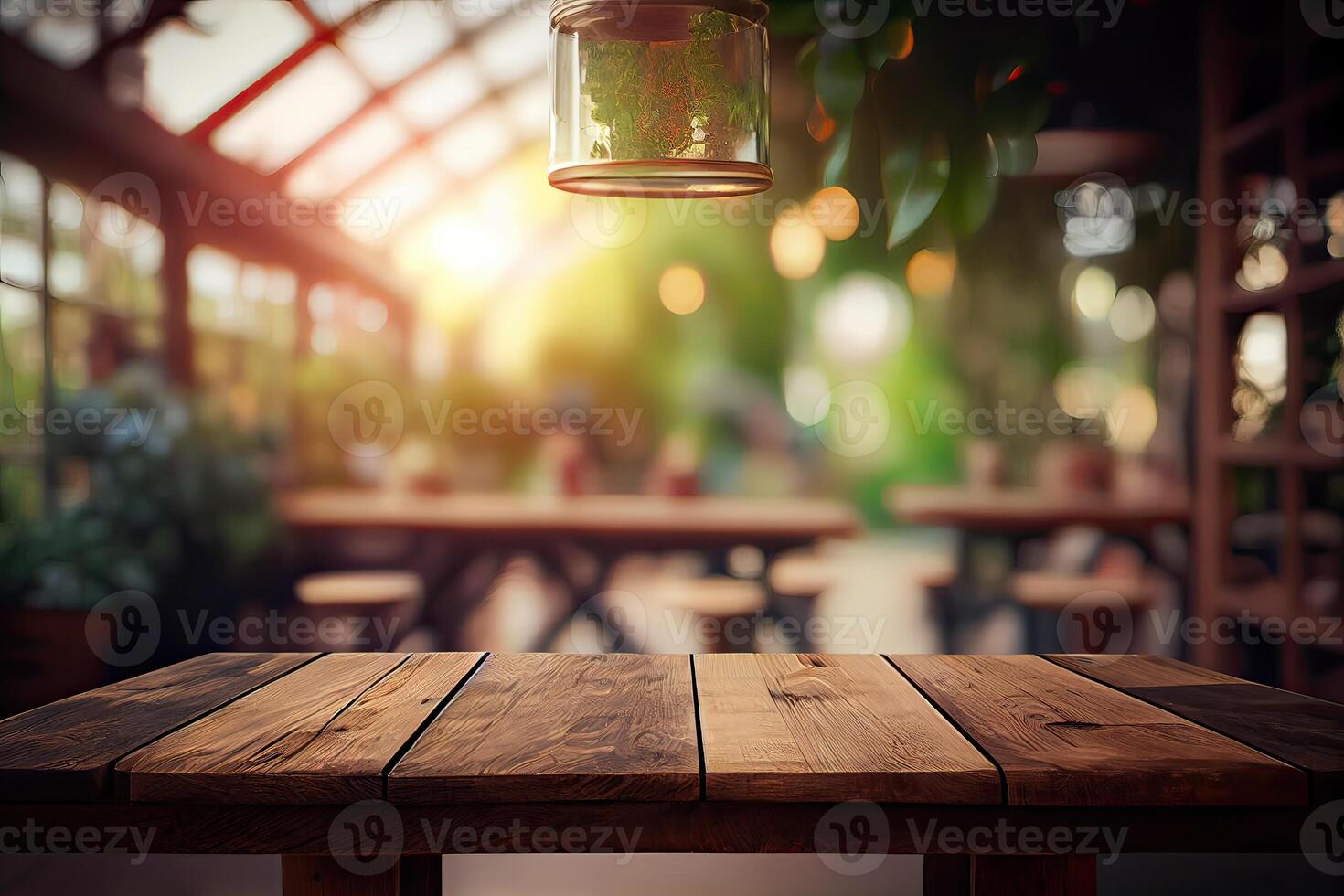 image of wooden table in front of abstract blurred background of resturant lights. Wood table top on blur of lighting in night cafe,restaurant background. selective focus. photo