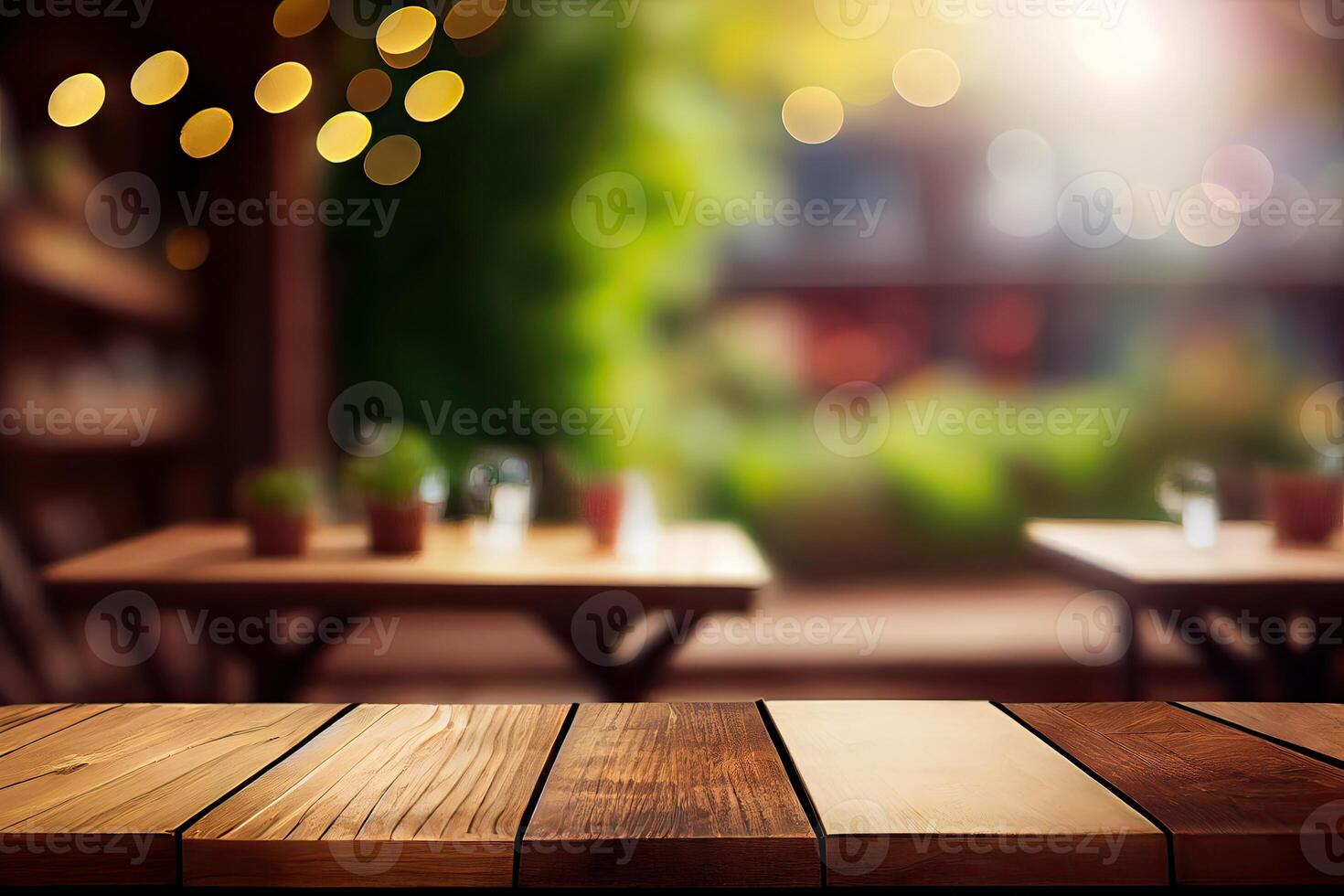 image of wooden table in front of abstract blurred background of resturant lights. Wood table top on blur of lighting in night cafe,restaurant background. selective focus. photo