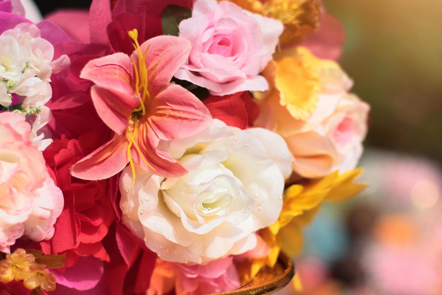 Bouquet of artificial flowers decoration in ceremony wedding. photo