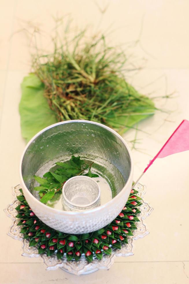 Silver water dipper set and flower garlands for Thai water pouring wedding ceremony photo