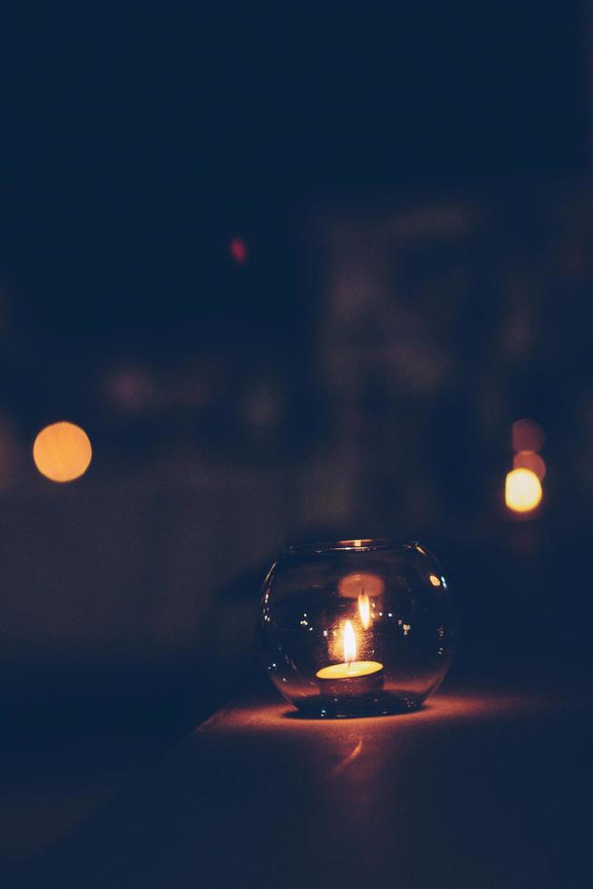 Candle light in Round glass decoration on white cloth for wedding and valentine day photo