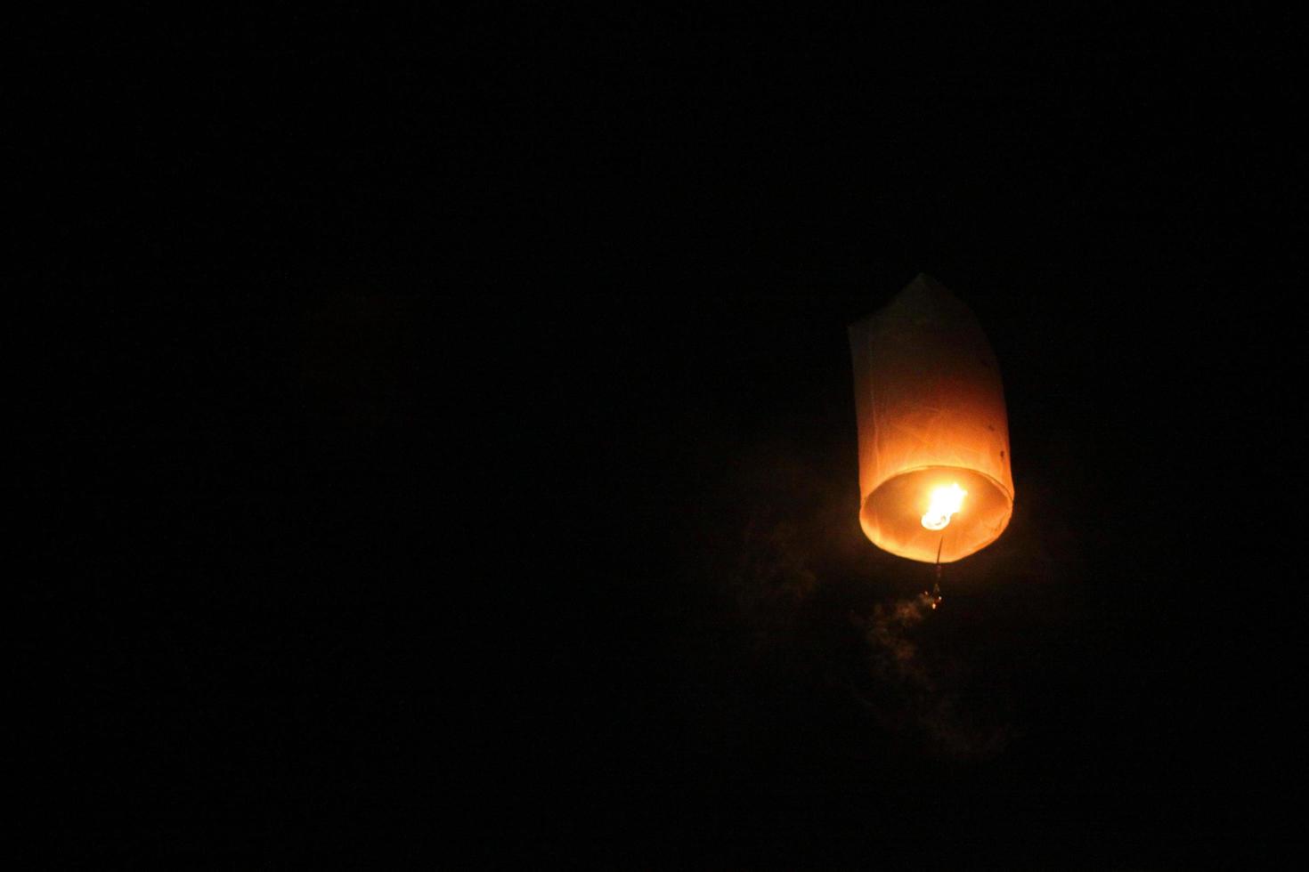 People are launching sky lanterns fire yeepeng is tradition in Floating lantern festival in northern of Thailand photo