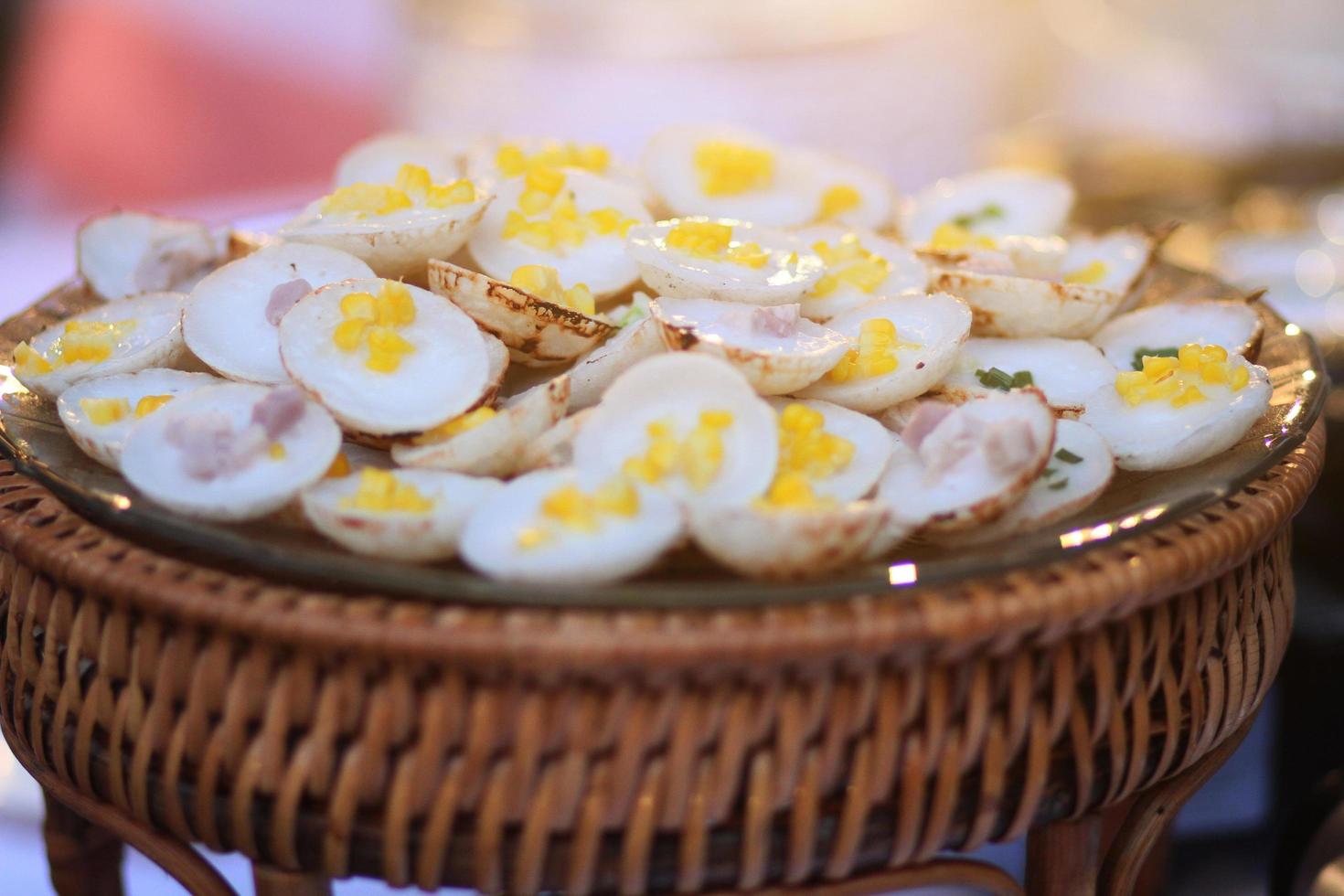 Kanom Krok is Thai Sweet dessert and savory grilled coconut-rice hotcakes in basket. photo