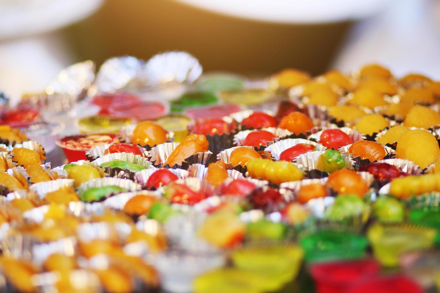 Colorful Deletable imitation fruits is Thai sweet dessert. Shaped Mung Beans call Kanom Look Choup in Thai. photo