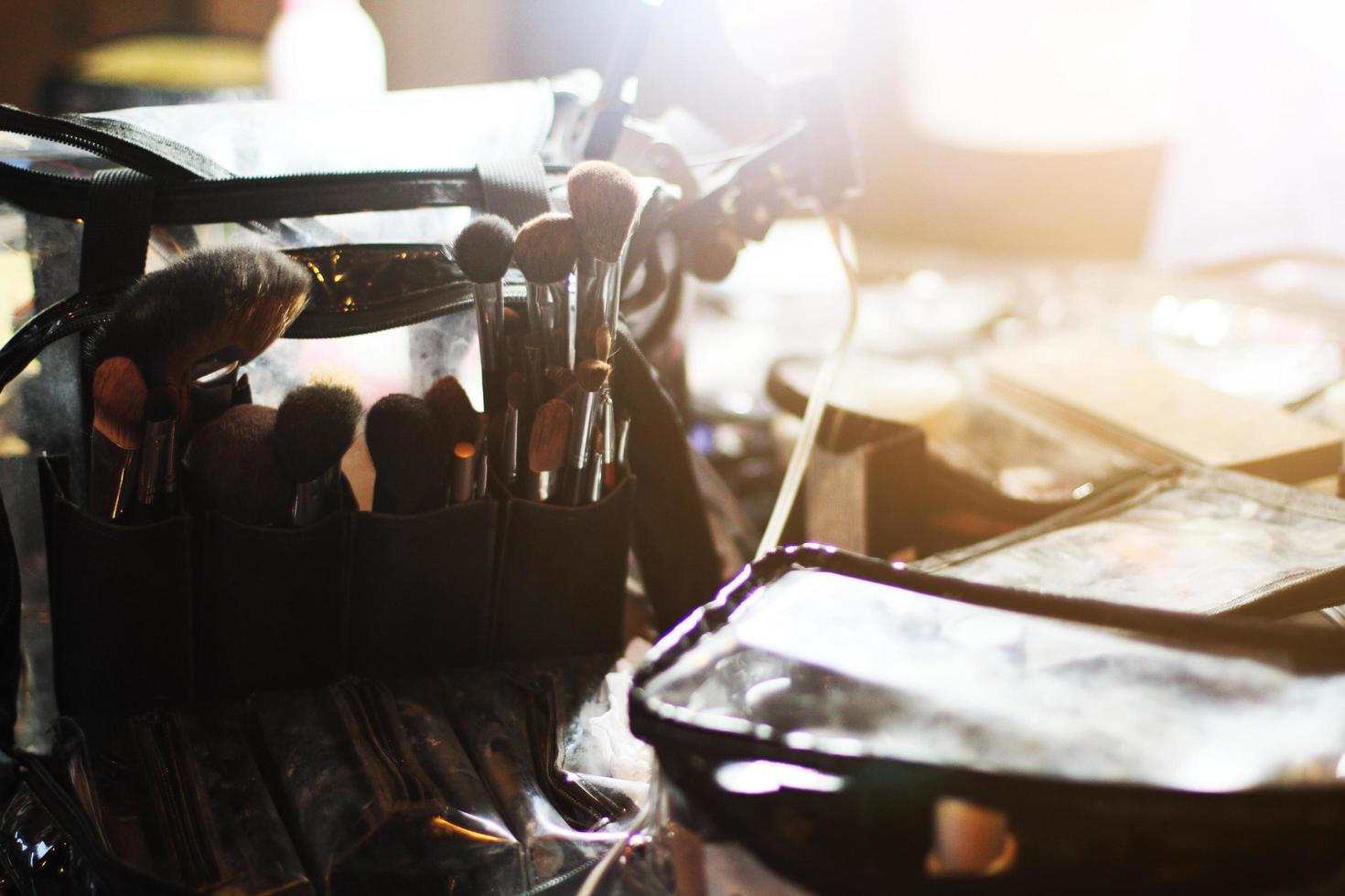 Make up brushes, blushes, eye shadows, face powders and lipstick for beauty and fashion. photo