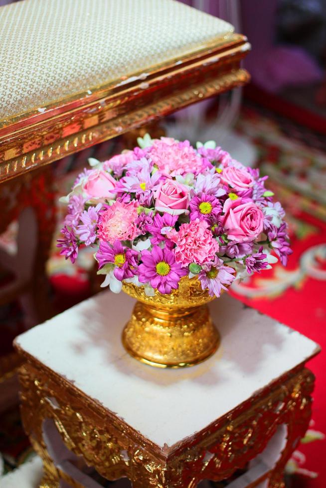 Beautiful flowers decoration on Engagement gold bowl for Thai engagement ceremony.Thai wedding culture tradition photo