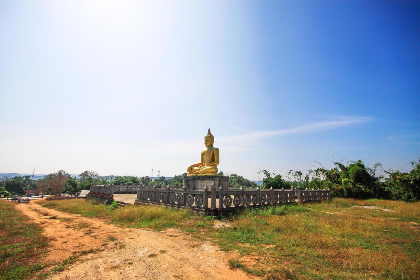 Golden Buddha statue and the old pagoda at ancient temple, Thailand photo