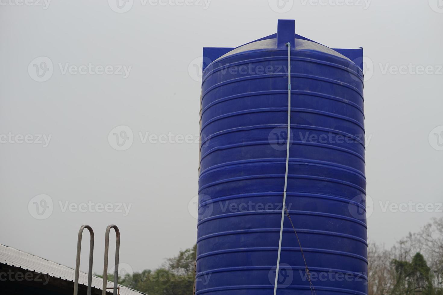 Big water tank outdoor for storage freshwater or rainwater to use in summer. Concept, prepare water to solve drought problems. Storage container for water using in accomodation or agriculture. photo