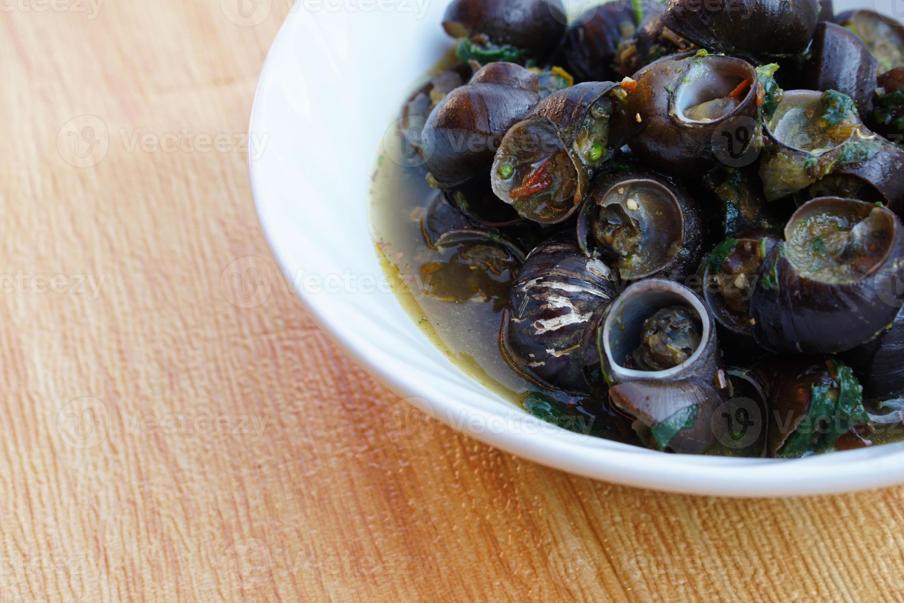 Kaeng Hoi Khom, River snails or Periwinkle curry on white bowl. Concept
