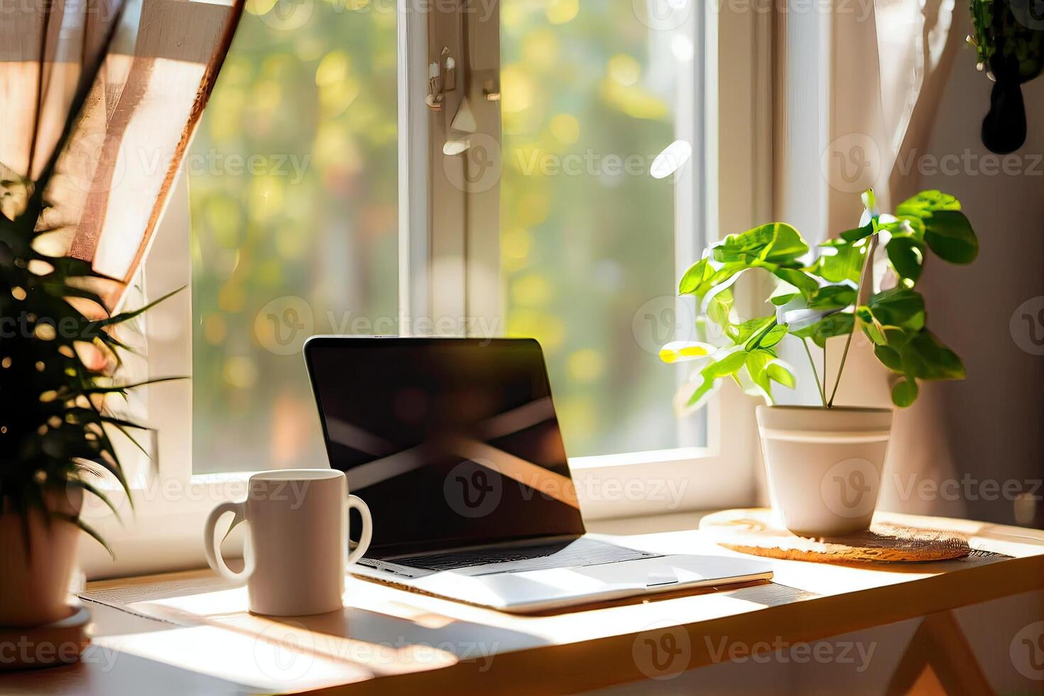 minimalist shot of a generic laptop computer and working accessories resting on a wooden table against the blurred background of the cafeteria. Selective focus. photo