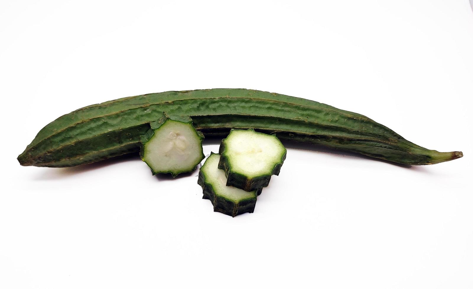 Green Luffa acutangula or Oyong isolated on white background photo