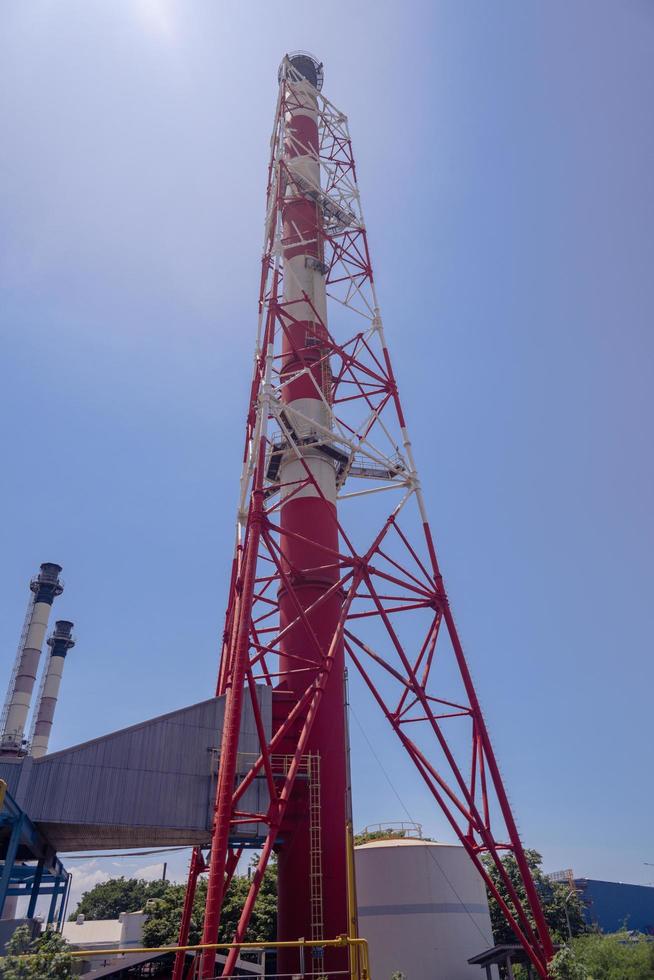 Landscape photo of chimney and stack of combine cycle power plant project. The photo is suitable to use for industry background photography, power plant poster and electricity content media.