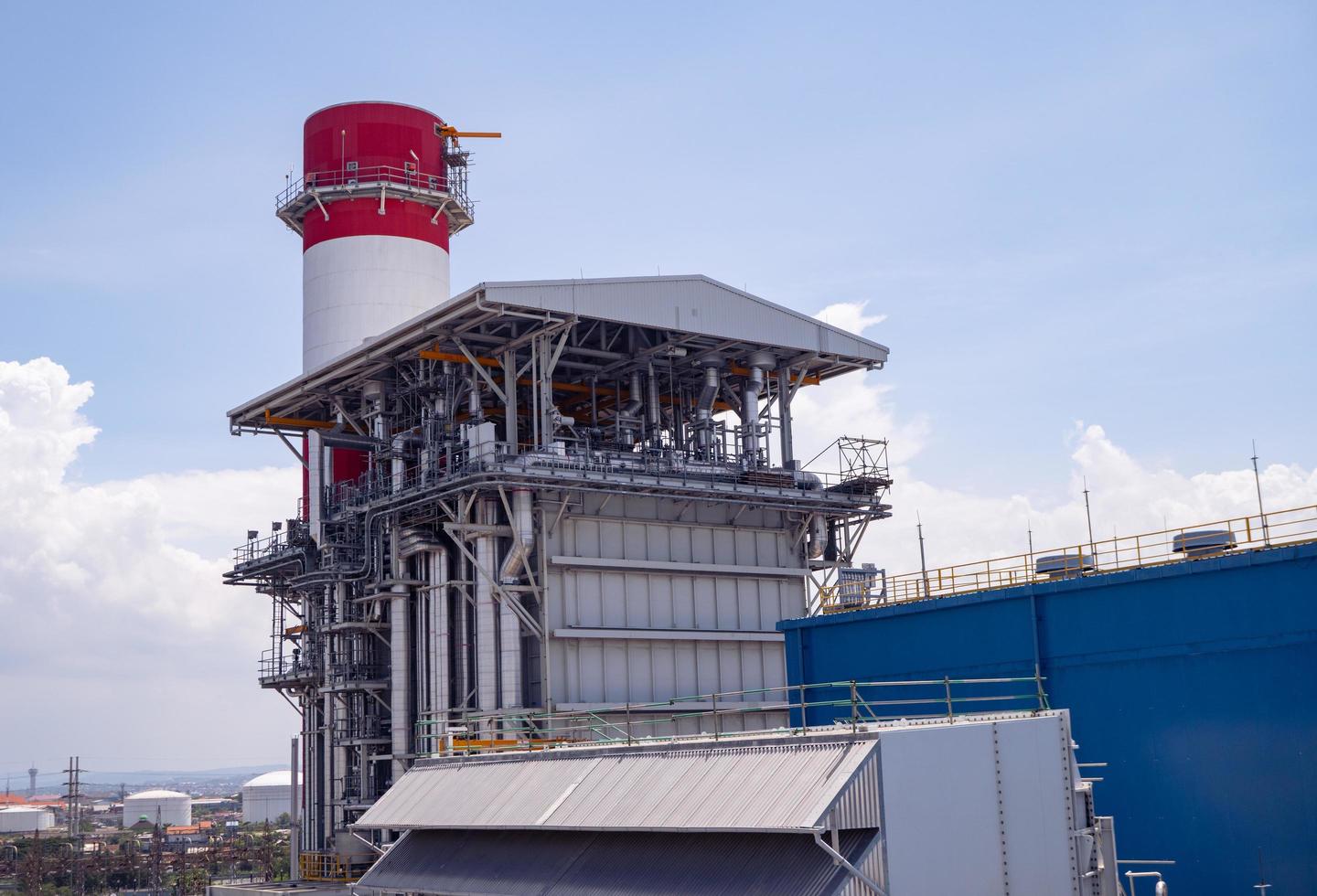 Landscape photo of chimney and stack of combine cycle power plant project. The photo is suitable to use for industry background photography, power plant poster and electricity content media.