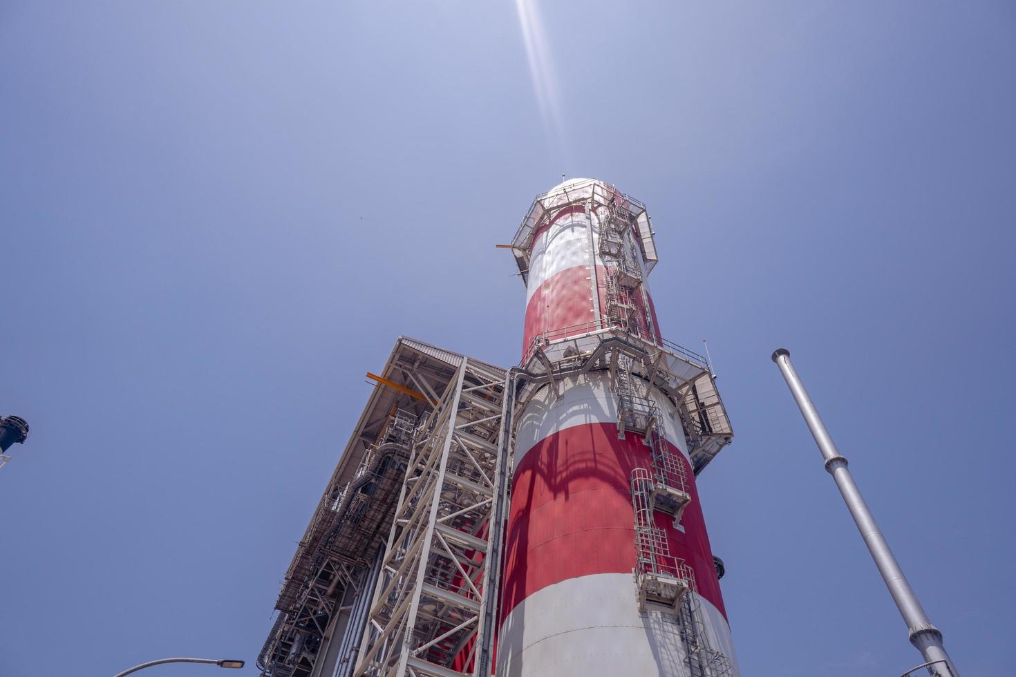 Landscape photo of chimney and stack of combine cycle power plant project. The photo is suitable to use for industry background photography, power plant poster and electricity content media.