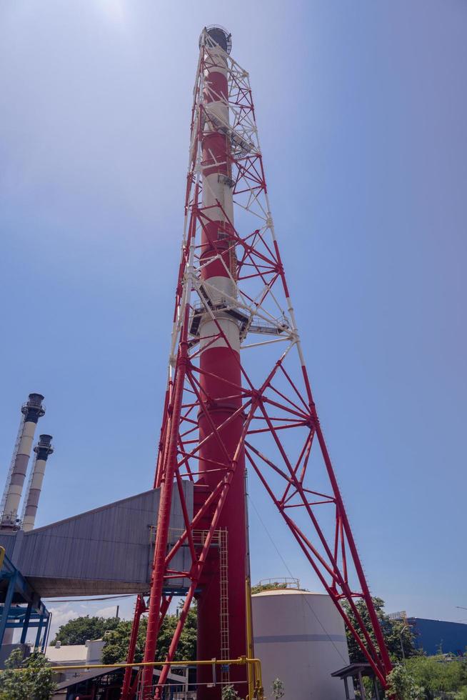 Landscape photo of chimney and stack of combine cycle power plant project. The photo is suitable to use for industry background photography, power plant poster and electricity content media.