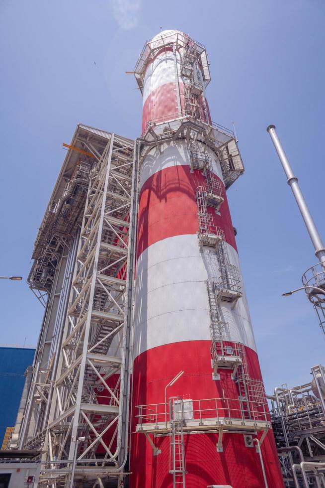 Landscape photo of chimney and stack of combine cycle power plant project. The photo is suitable to use for industry background photography, power plant poster and electricity content media.