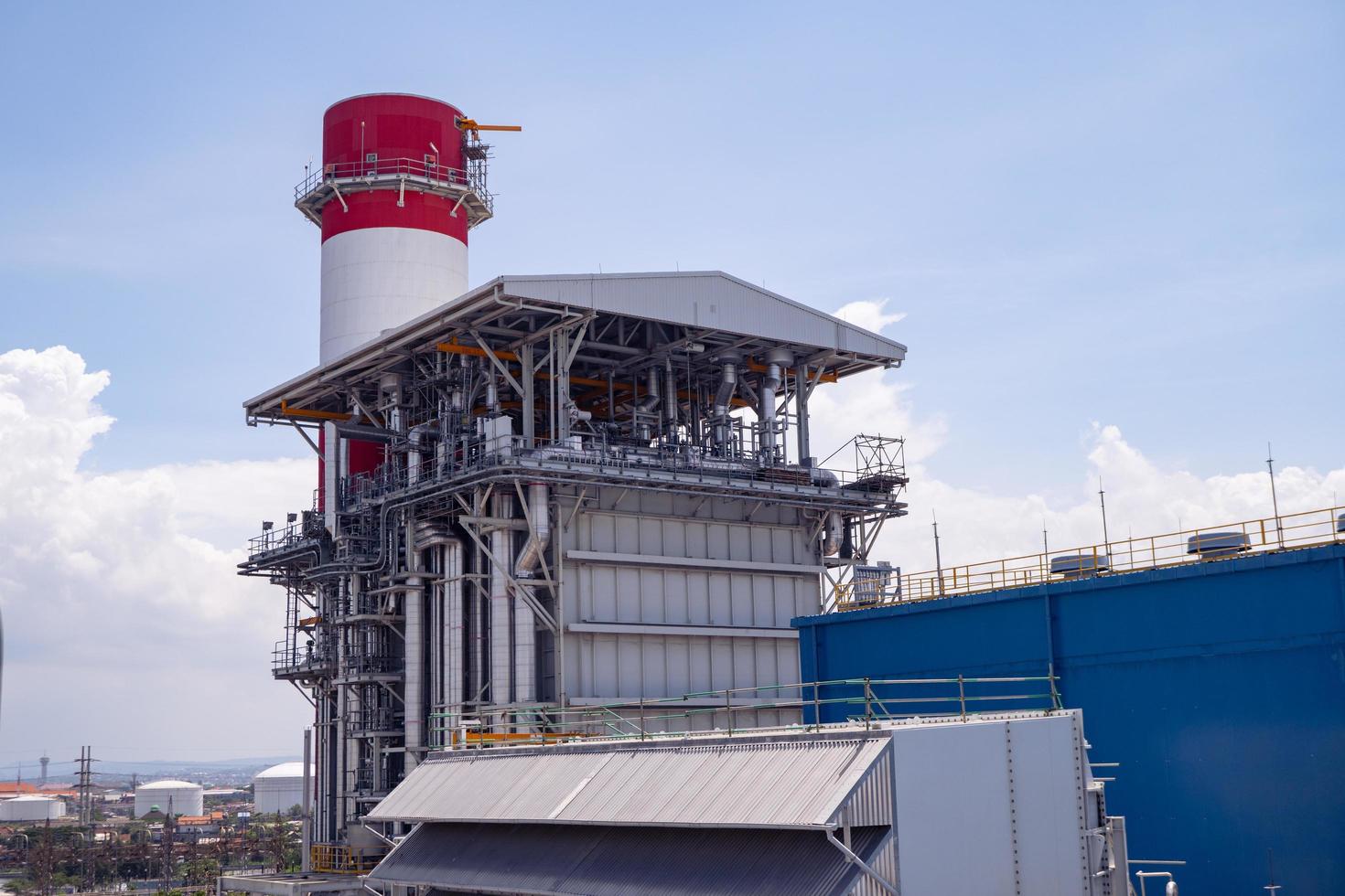 Landscape photo of chimney and stack of combine cycle power plant project. The photo is suitable to use for industry background photography, power plant poster and electricity content media.