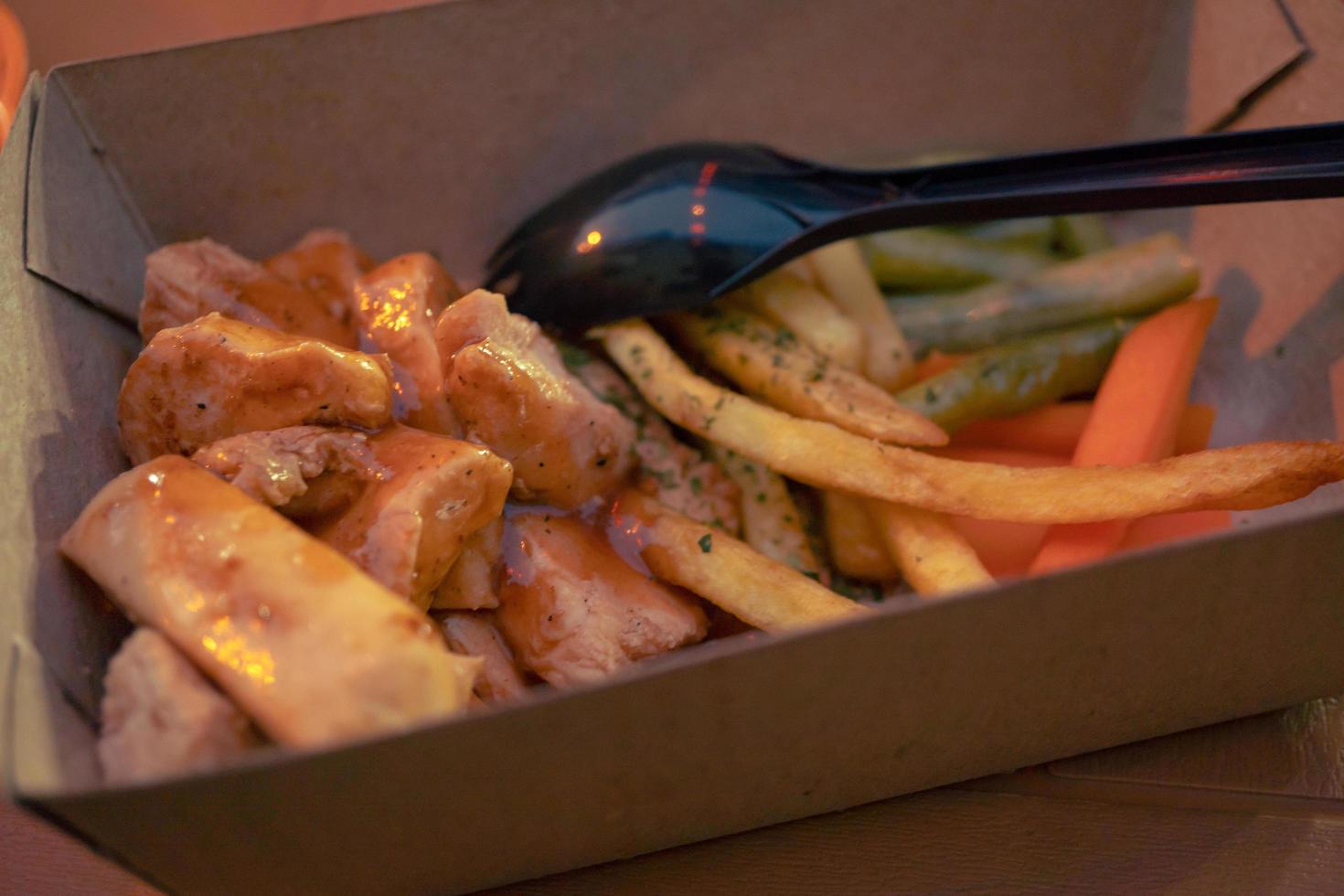 Fried chicken steak with fired fries bean and barbeque black paper sauce. The photo is suitable to use for food background, poster and food content media.