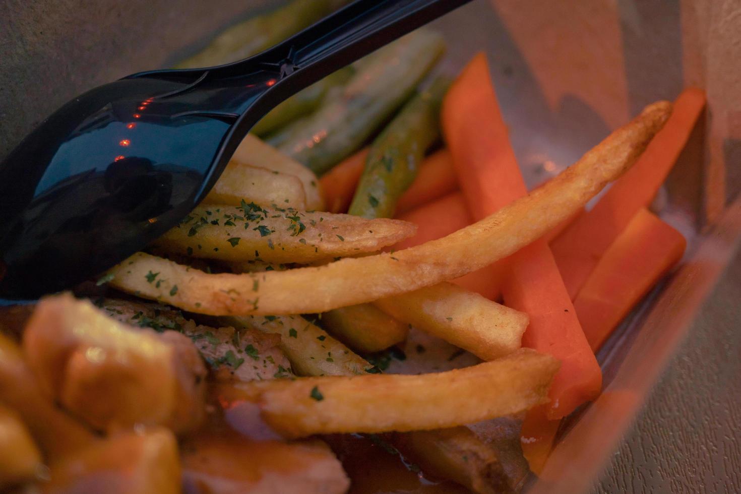 Fried chicken steak with fired fries bean and barbeque black paper sauce. The photo is suitable to use for food background, poster and food content media.