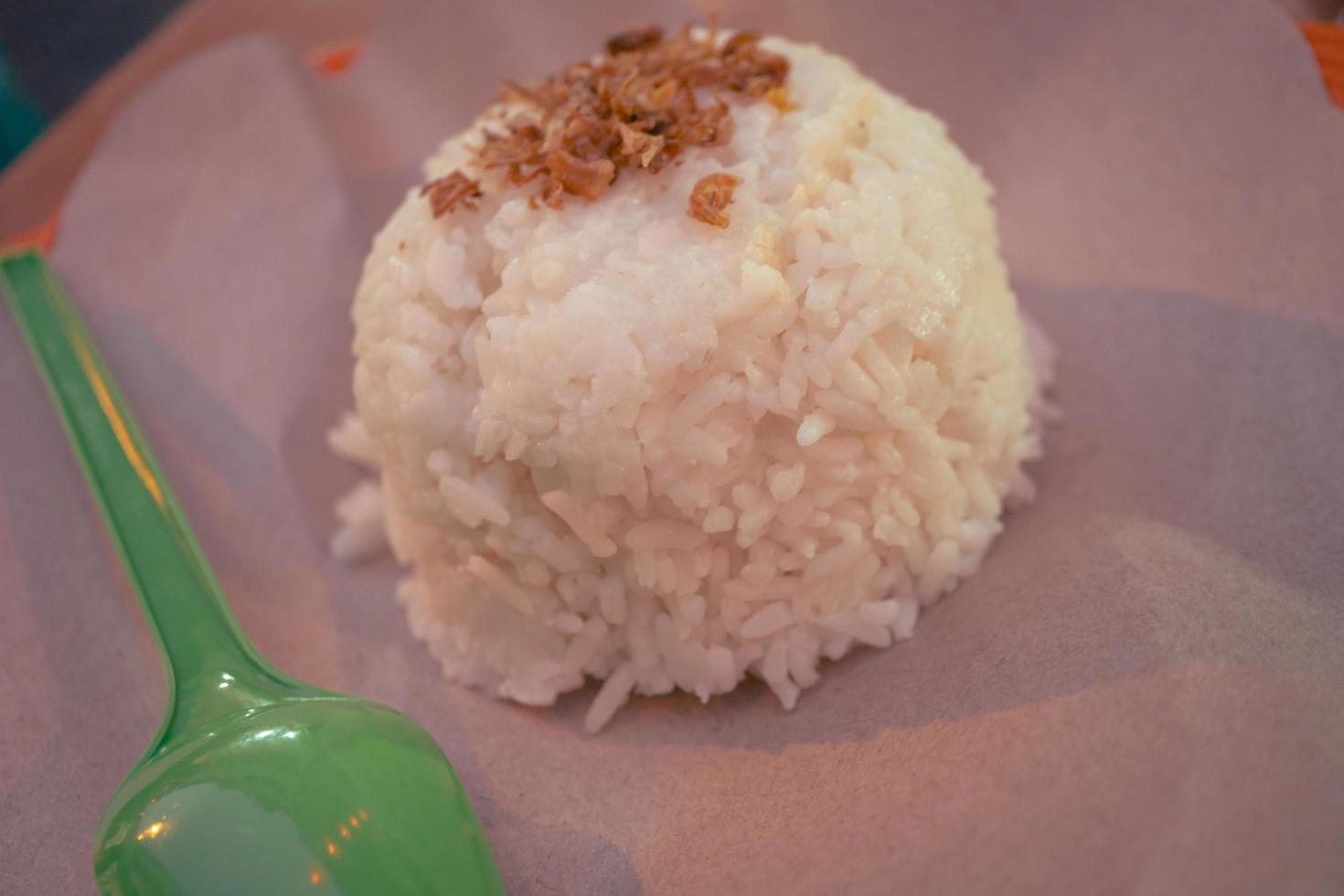 Close up photo white rice main course traditional restaurant Semarang. The photo is suitable to use for food background, menu poster and advertising.